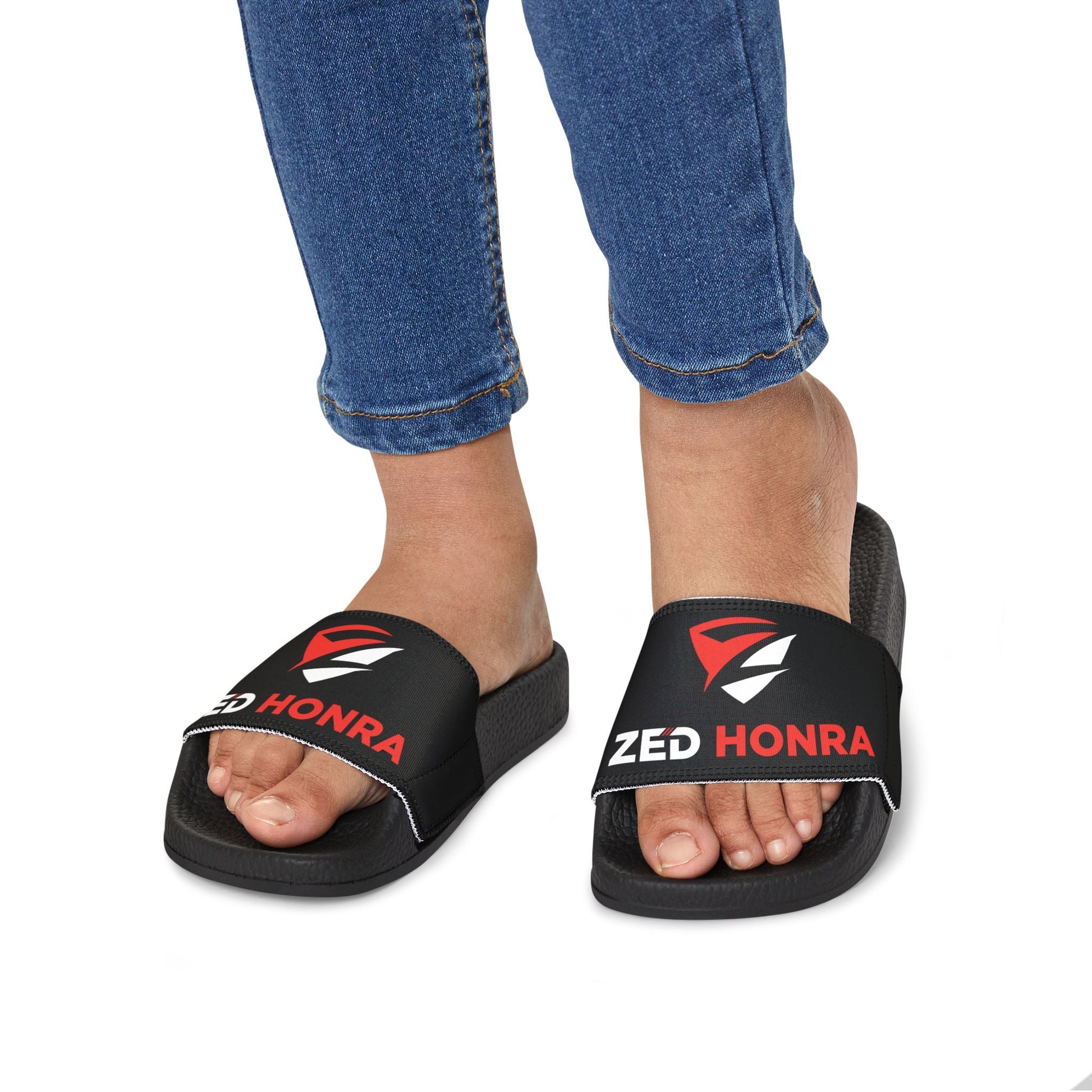 Zed Honra youth sandals in black – worn by child, front view