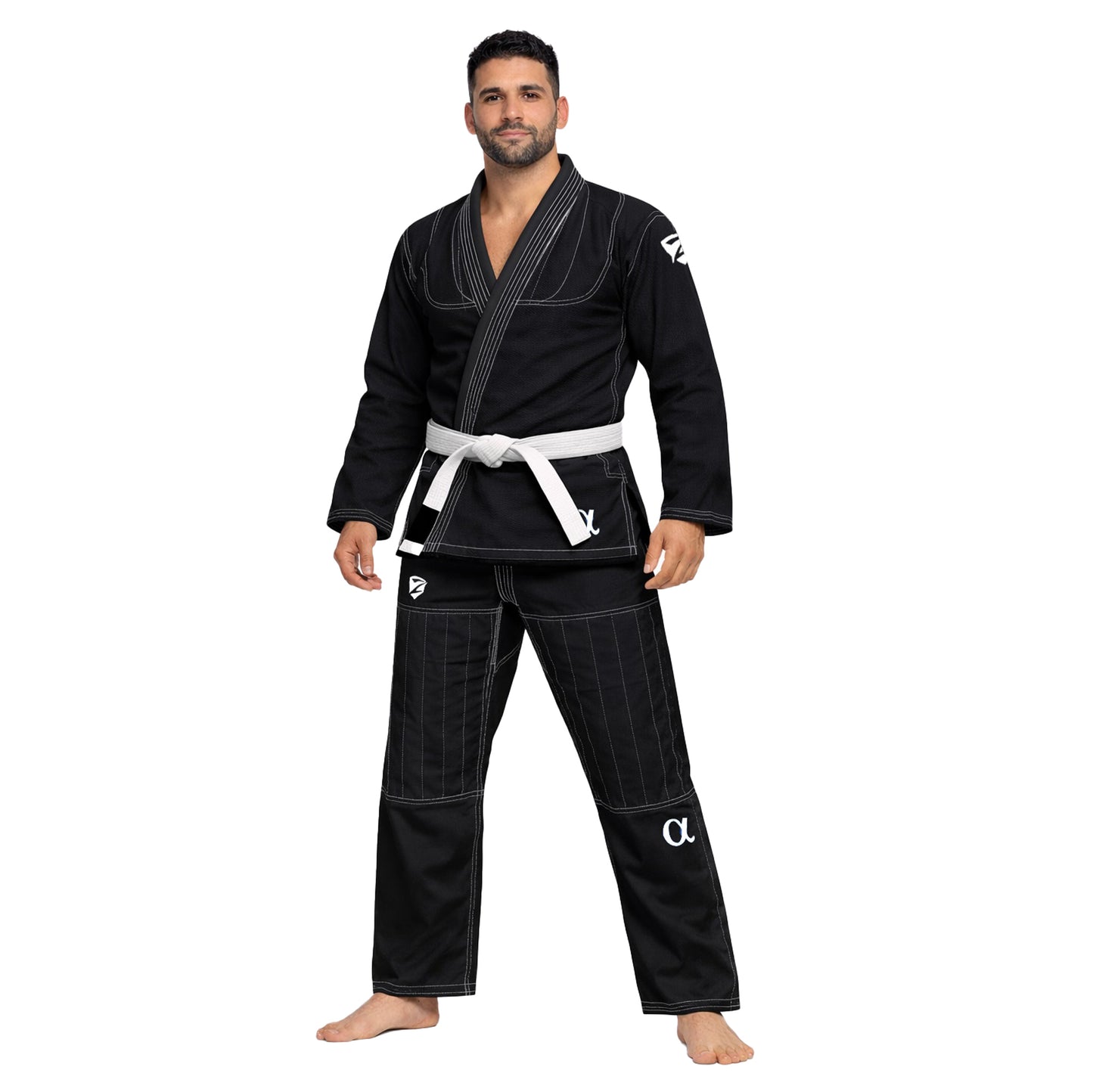 Man wearing a black BJJ gi with white belt on a white background