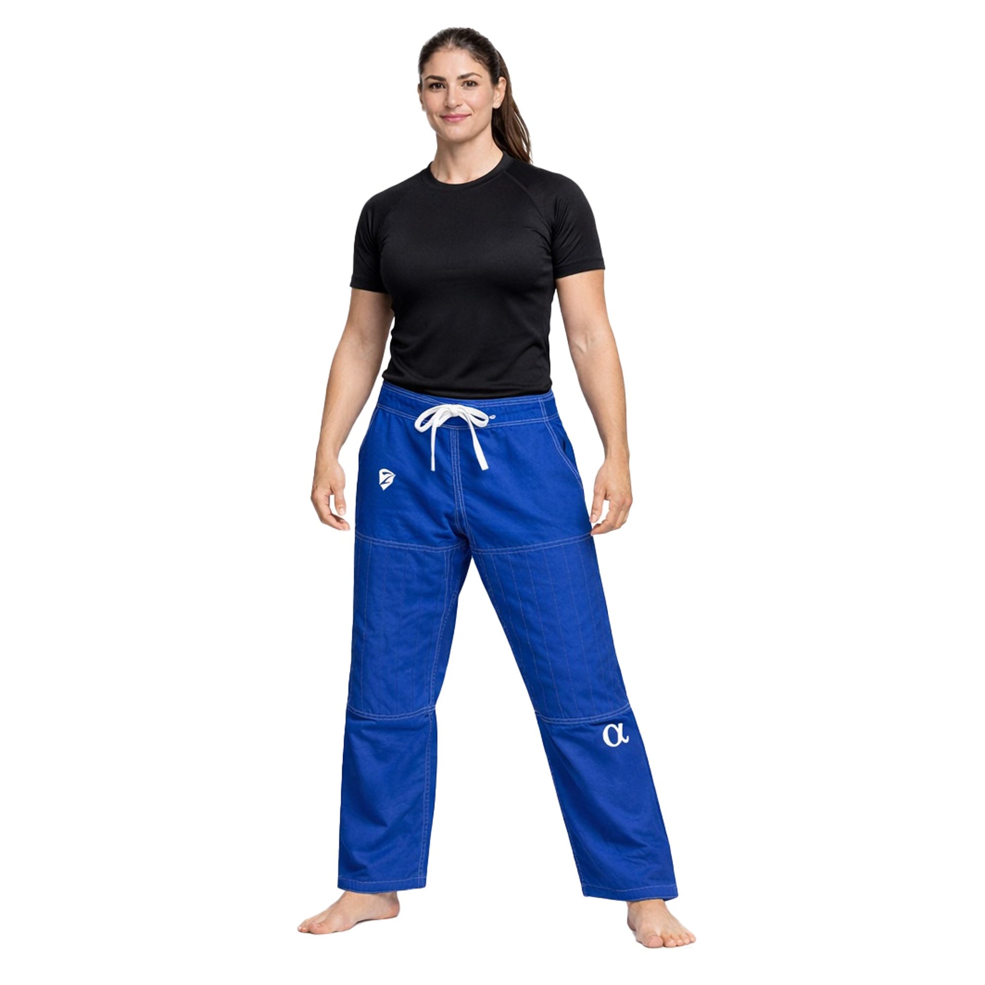 Woman wearing blue pants and black shirt on a white background