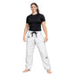 Woman wearing a black t-shirt and white pants with a logo on a white background