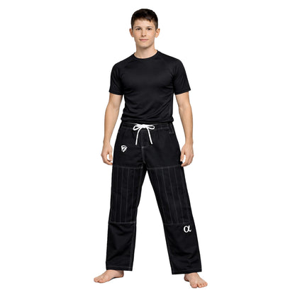 Person wearing a black martial arts uniform with white logo on a white background